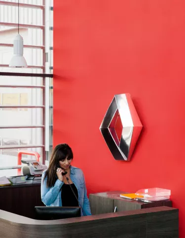 Woman on the phone in a Renault Trucks dealership